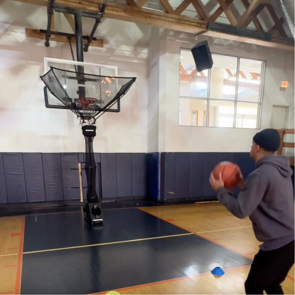 Eric shooting with HOOPTEQ on indoor court