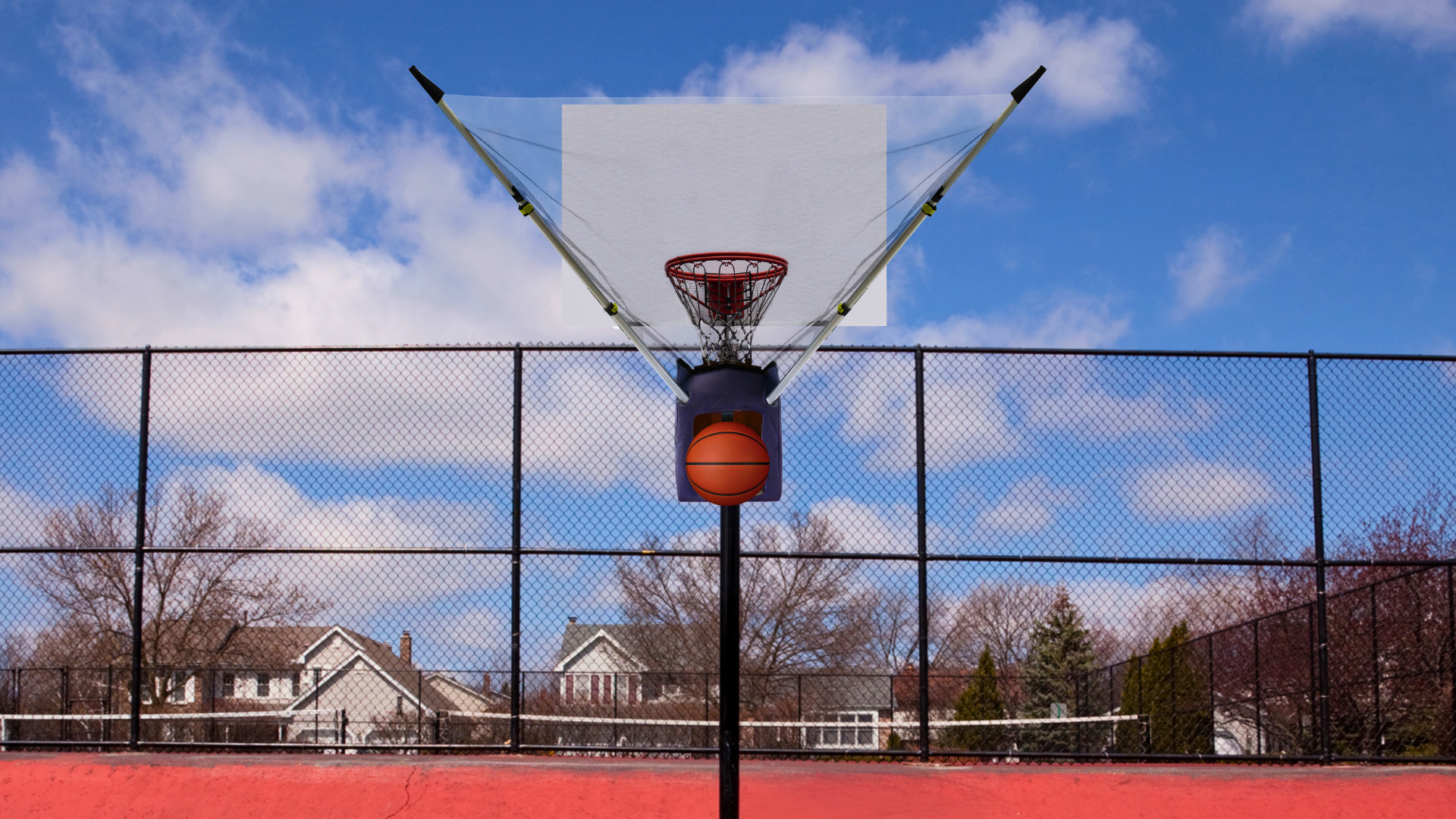 HOOPTEQ shooting machine set up on a basketball rim at an outdoor neighborhood court