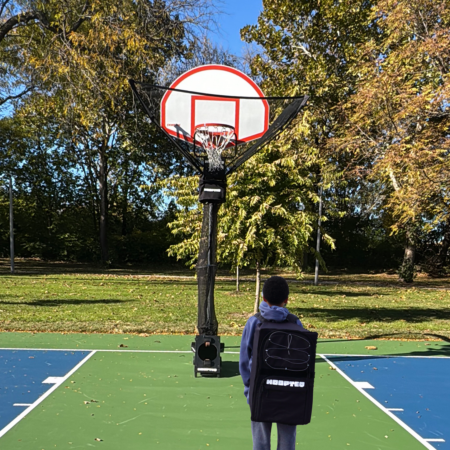 HOOPTEQ_hooper_with_backpack on outdoor court