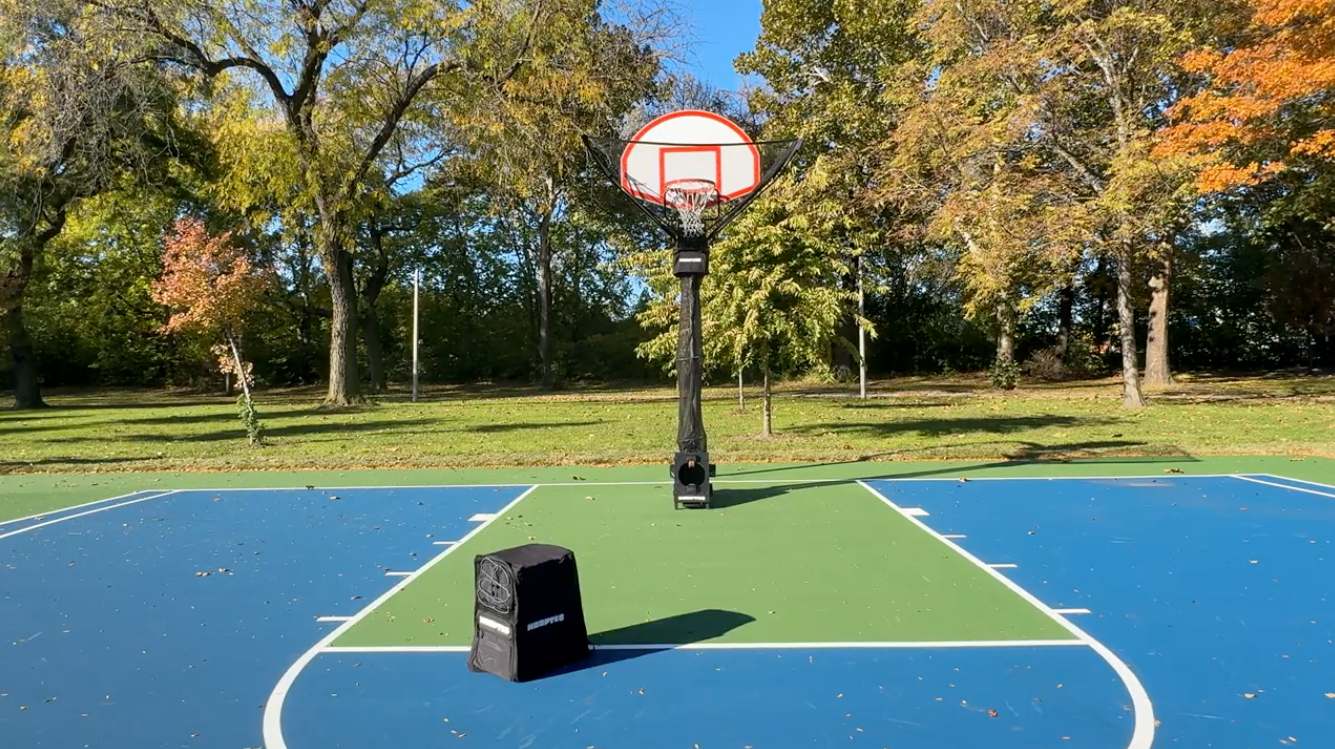 HOOPTEQ outdoors with backpack on basketball court