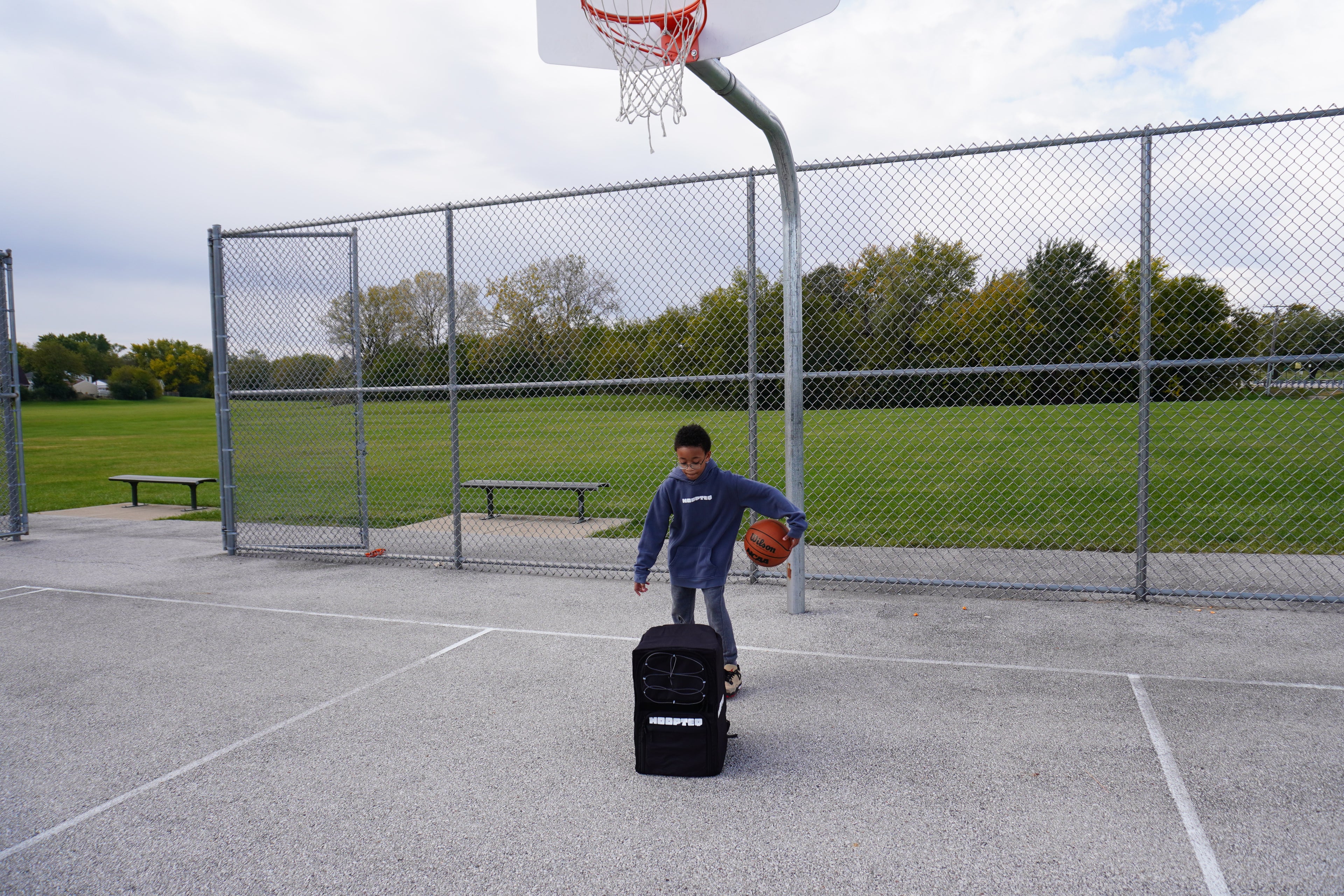 Hooper with HOOPTEQ and Basketball on outdoor court